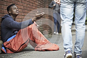 Homeless Teenage Boy Begging For Money On The Street