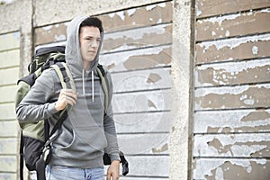 Homeless Teenage Boy On Street With Rucksack