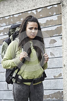 Homeless Teenage Girl On Street With Rucksack photo