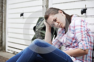 Homeless Teenage Girl On Streets With Rucksack