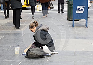 Homeless voman at 5th Avenue in Midtown Manhattan