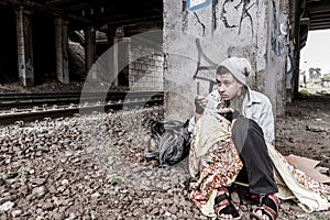 Homeless woman having meal