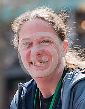 Homeless woman smiling with bad teeth