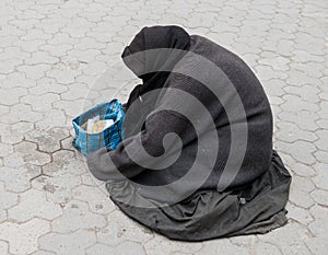 Homeless woman on the street