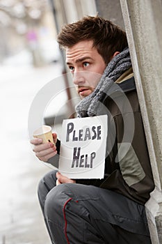 Homeless Young Man Begging In Street