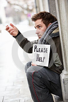 Homeless Young Man Begging In Street