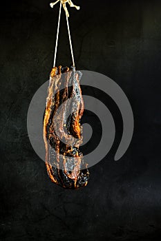 Homemad preserved meat in saya sauce hanging for drying in Asian countries