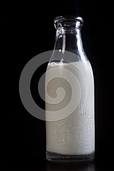 Homemade almond milk on the black background