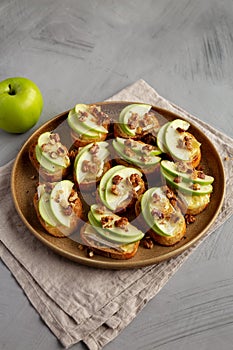 Homemade Apple Brie Crostinis on a Plate, side view. Close-up