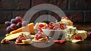 Homemade apple and chilli chutney with cheese, snack, nuts, fruits