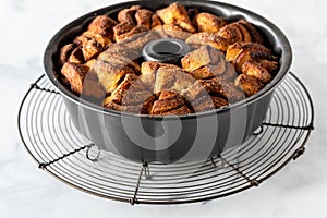 A homemade apple cinnamon pull apart bread in a bundt pan, fresh out of the oven