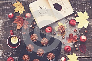 Homemade apple muffins and cup of tea with lemon, autumn mood