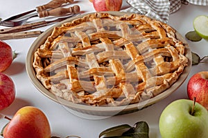 Homemade Apple Pie with fresh apples on a table background, Classic Thanksgiving dessert apple pie