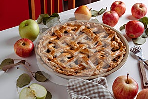 Homemade Apple Pie with fresh apples on a table background, Classic Thanksgiving dessert apple pie