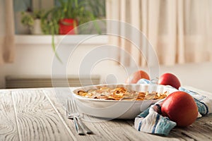 Homemade apple pie on a white wooden background near the window close-up and copy space. Charlotte in the morning on the table