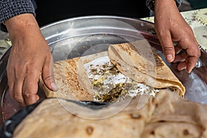 Homemade arabian flatbread other names is pita, lavash, lafa, parantha, roti, chapati with olive oil, zaatar and labneh