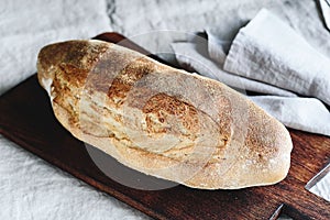 Homemade Artisan sourdough bread on wooden cutting board