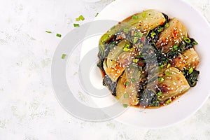 Homemade asian sauteed soy bok choy with sesame seeds. Stir fry pak choi.