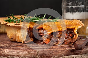 Homemade australian meat pie on the wooden table