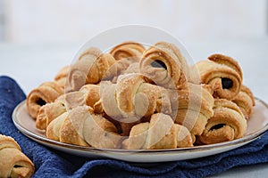 Homemade bagel cookies with marmalade inside. Sweet croissant cookies. Selective focus