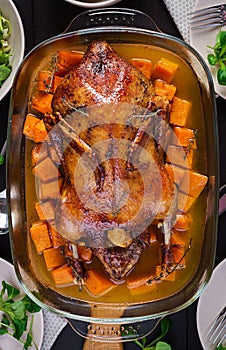 Homemade baked duck. Crispy whole roast duck. Thanksgiving or Christmas dinner.