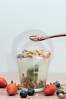 Homemade baked granola berry fruit yogurt