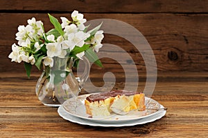 Homemade baked pudding with chololate icing and jasmine flowers