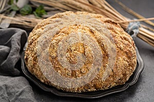 Homemade baked round bread with corn and wheat