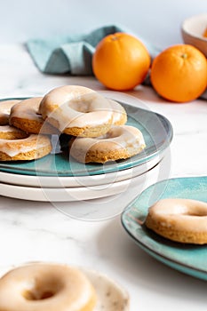 Homemade baked whole wheat vegan donuts with orange glaze