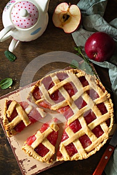 Homemade baking. Sweet apple pie on a rustic wooden table.