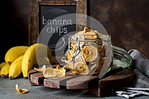 Homemade banana chips in a glass jar