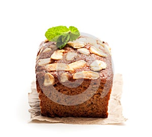 Homemade banana loaf cake with fresh bananas isolated on white