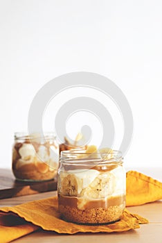 Homemade banoffee pie in a glass cup