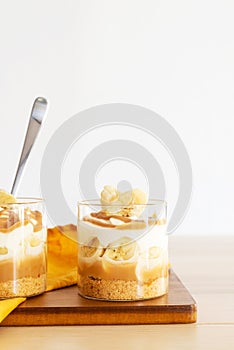 Homemade banoffee pie in a glass cup