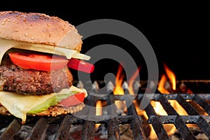 Homemade BBQ Beef Burger On The Hot Flaming Grill photo