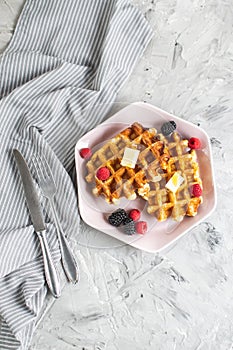 Homemade Belgian Waffles with Butter Honey Berries Raspberries Blackberries Table Kitchen Towel