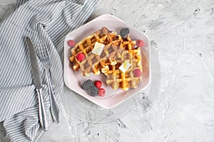 Homemade Belgian Waffles with Butter Honey Berries Raspberries Blackberries Table Kitchen Towel