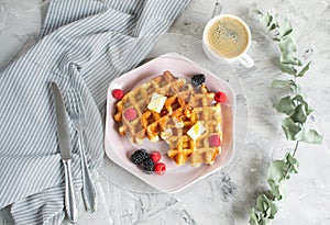 Homemade Belgian Waffles with Butter Honey Berries Raspberries Blackberries Table Kitchen Towel