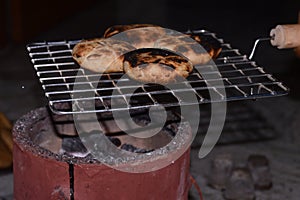 Homemade bihari Litti baked on traditional coal stove