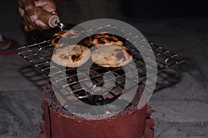 Homemade bihari Litti baked on traditional coal stove