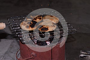 Homemade bihari Litti baked on traditional coal stove