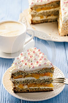 Homemade bisÑuit cake with whipped cream and peaches.