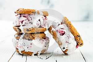 Homemade Black Forest roasted cherry ice cream sandwiches with chocolate chip cookies.