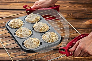 Homemade blueberry bran muffins with almond in bakeware