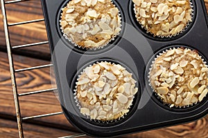 Homemade blueberry bran muffins with almond in bakeware