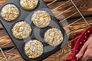 Homemade blueberry bran muffins with almond in bakeware