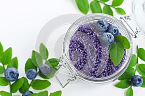 Homemade blueberry sugar scrub/bath salts/foot soak in a glass jar. DIY cosmetics for natural skin care.