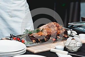 Homemade bone-in prime rib roast on wooden plank