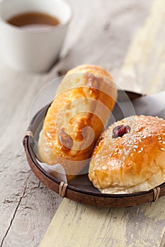 Homemade bread in basket on wooden table