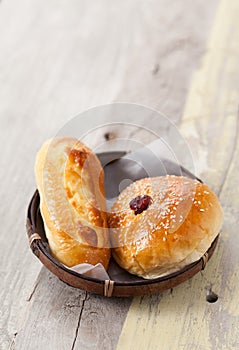 Homemade bread in basket on wooden table, Selective focus